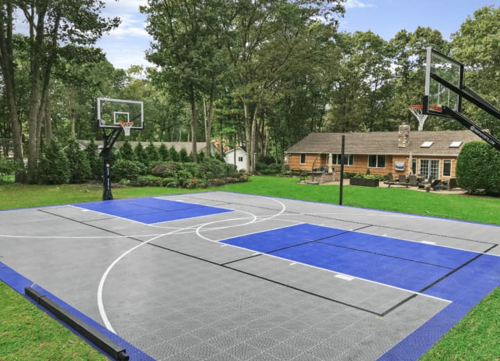 Professional Concrete Basketball Court installation in Charlotte, North Carolina by Local Concrete Co — commercial-grade base prep, 6-inch compacted aggregate, expansion joints sawn within 12 hours.