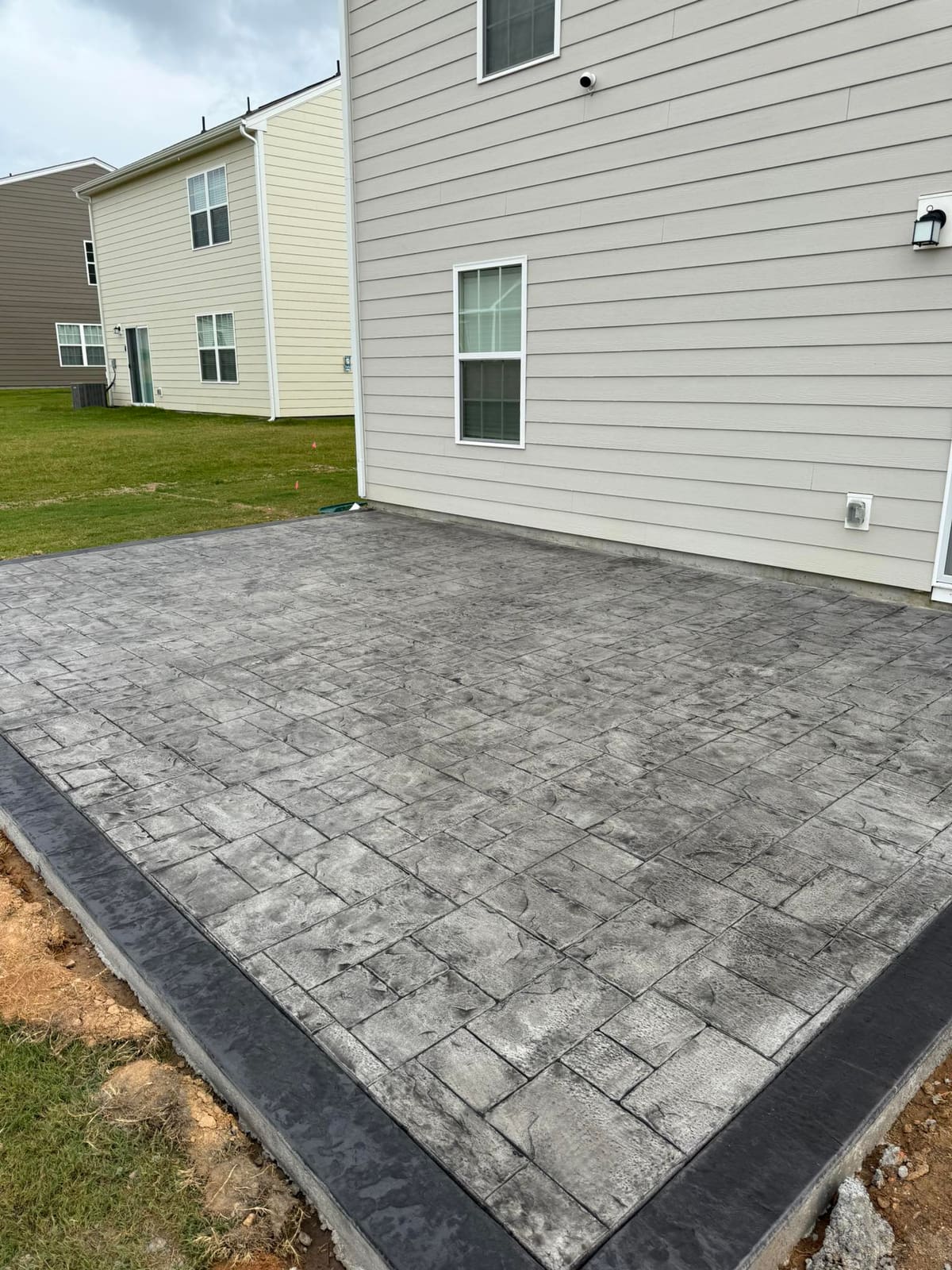 Professional Stamped Concrete installation in Charlotte, North Carolina by Local Concrete Co — commercial-grade base prep, 6-inch compacted aggregate, expansion joints sawn within 12 hours.