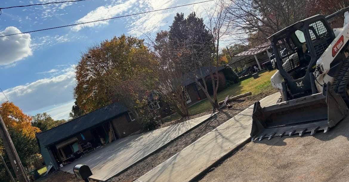 Newly poured Concrete Driveway Replacement in Mooresville, NC (Iredell County) by Local Concrete Co — 4000 PSI mix, double-mat #4 rebar, broom-finish surface, 28-day full cure.